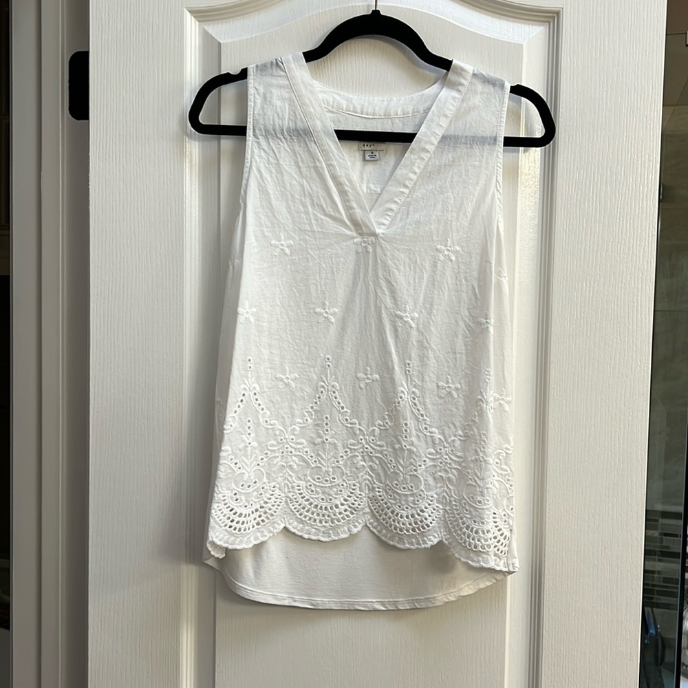 White tank blouse. No stains or damage.